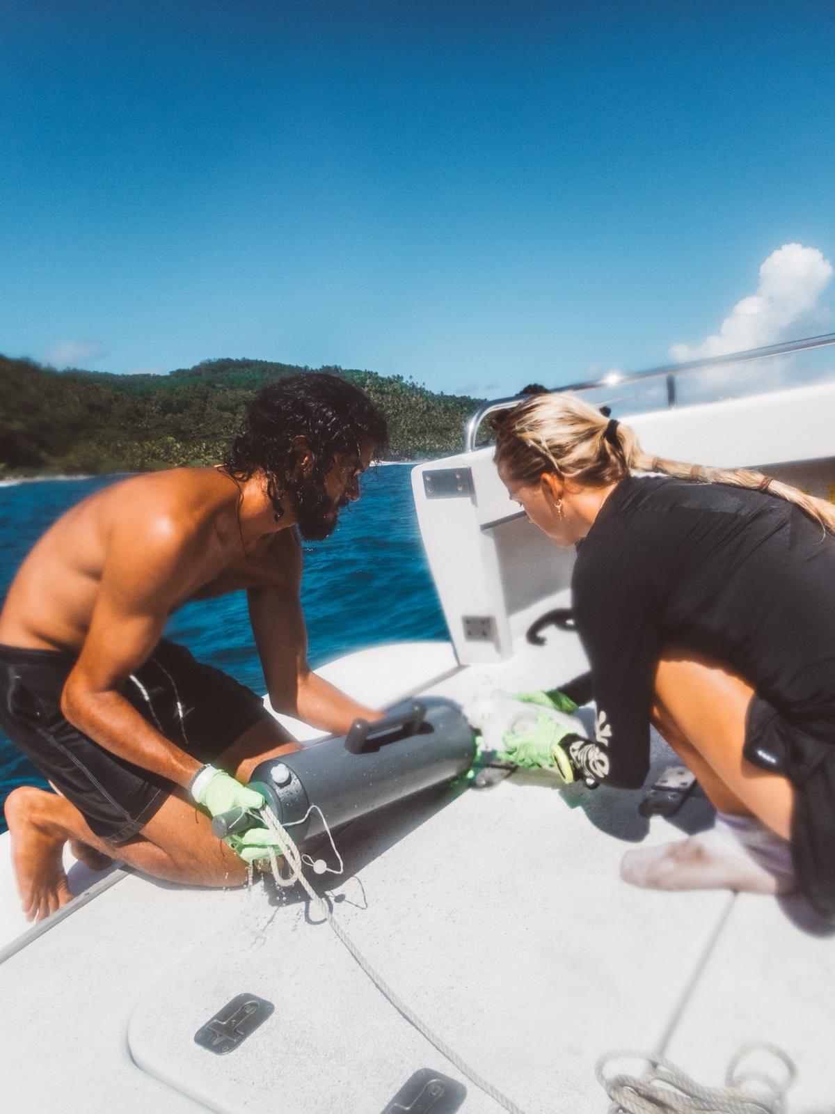 PhD researcher together with conservation team on Fregate Island collecting eDNA