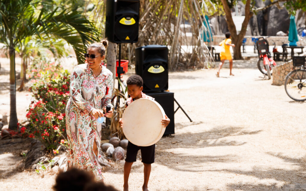 Mrs. Farida Camille is introducing the program the Unique Foundation prepared for Creole Festival